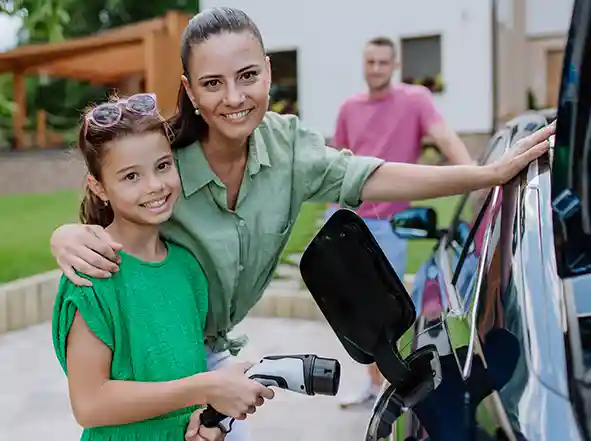 happy mum daughter evcharging